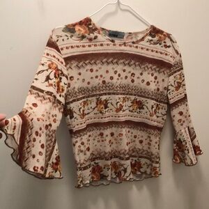 Jean Paul Gaultier style sheer top with cute sleeve detail and lettuce edges